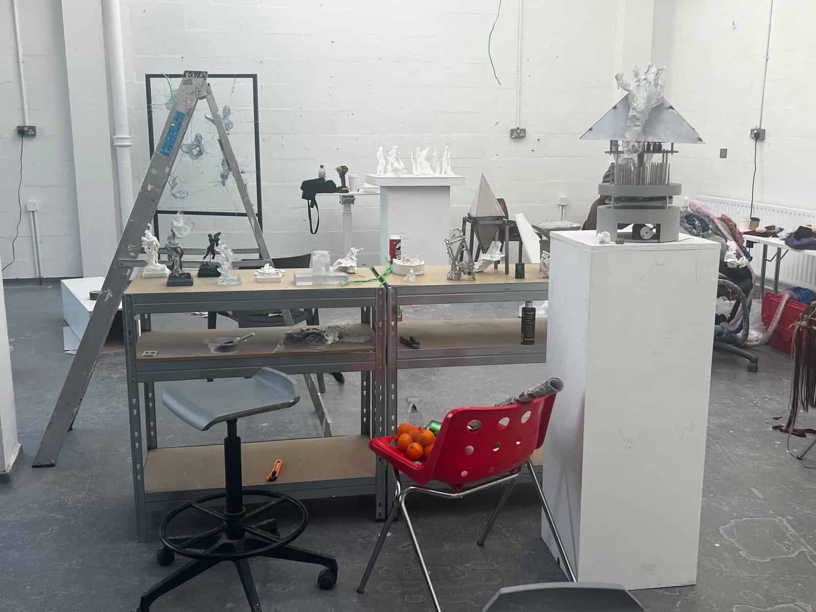 Studio table with modular prototypes and material tests for Scarlett Guan’s Stacked Cities project.