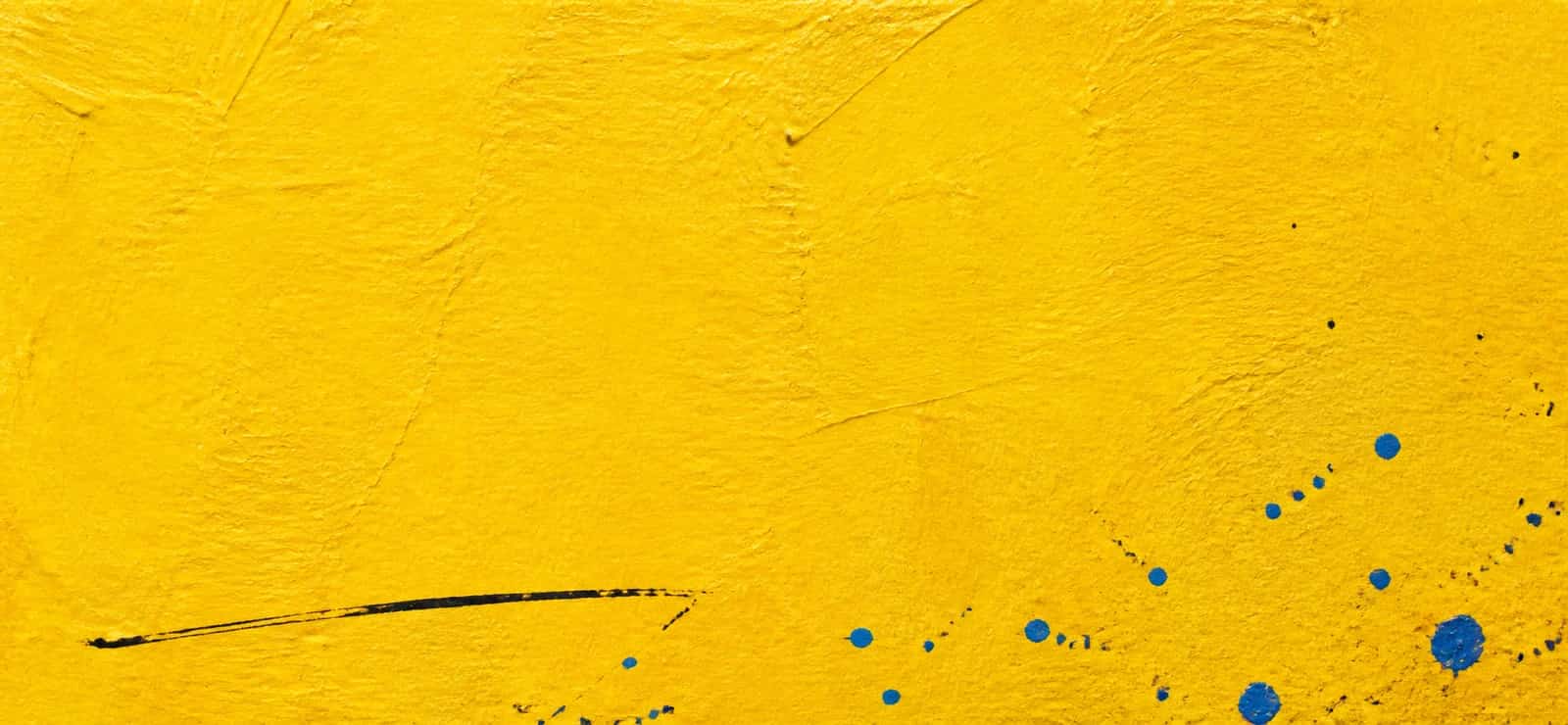 A sunflower-yellow painted paper note with black hand-drawn lines and cobalt paint droplets.