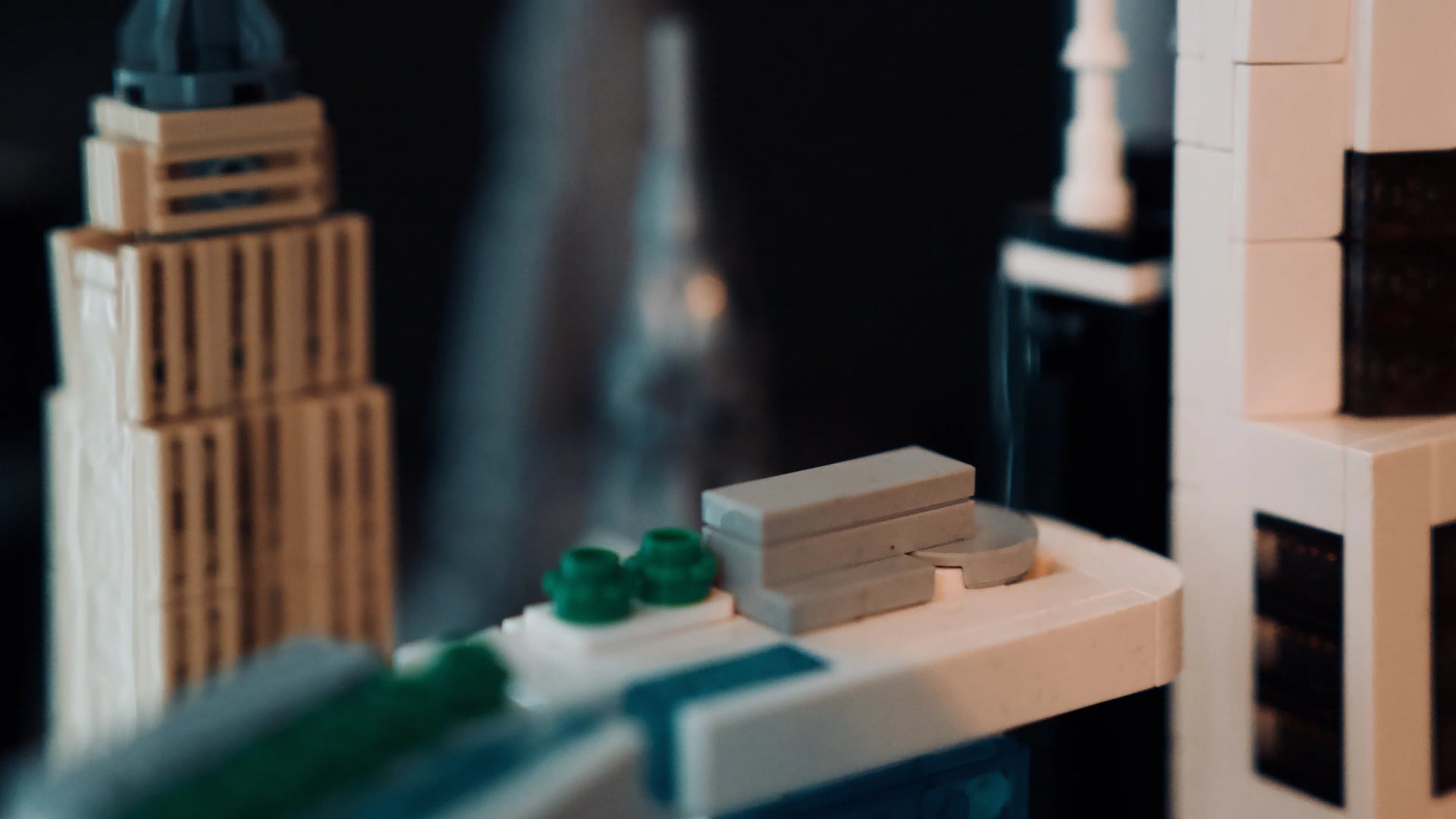 Close view across a LEGO city with white, black and translucent modular buildings.
