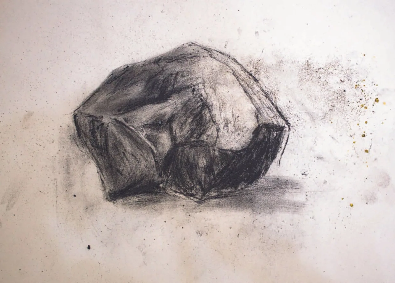 EN: Charcoal and coal dust drawing of a stone, foreshadowing later installation works with real rocks.