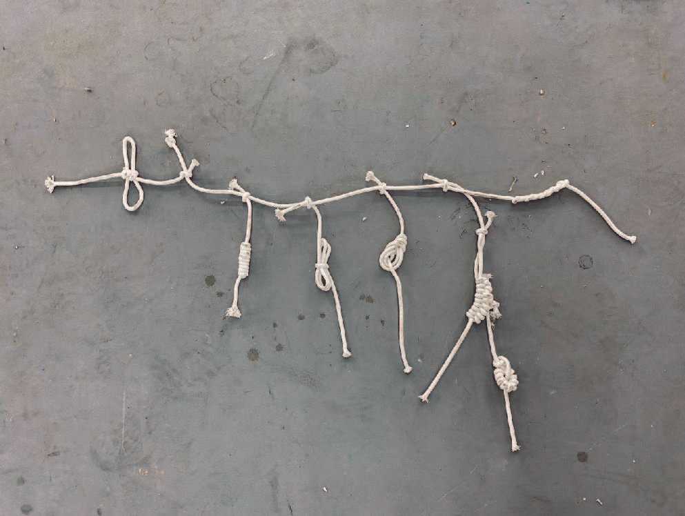 Series of white cotton knots forming a linear time code.